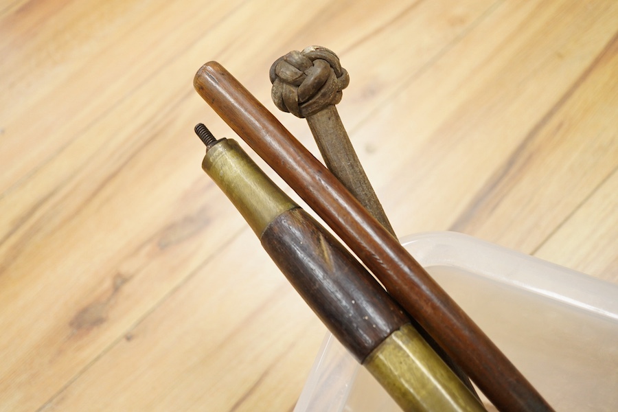 Eighteen assorted world weapons comprising a silver jambya (pommel missing), a knobkerry, a dha, two kris (one with handle missing), a lohar, three kukris, a djambok, a Chinese trousse, a chora, a flyssa, five others and